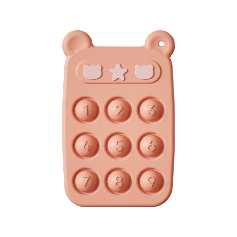 Jouet sensoriel en silicone, facile à nettoyer, posé sur une table