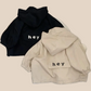 Veste enfant beige et noire avec capuche, vue de face