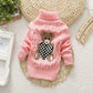 Pull enfant col roulé, détail des manches en tricot torsadé