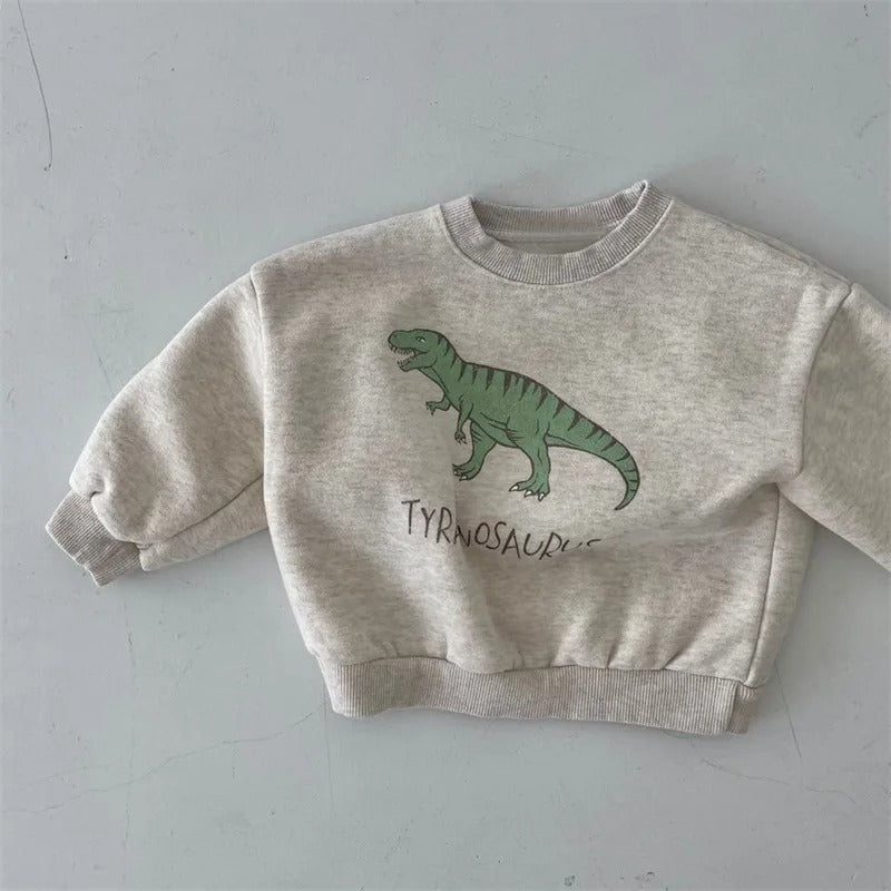 Détail des manches du sweat dinosaure en coton doux