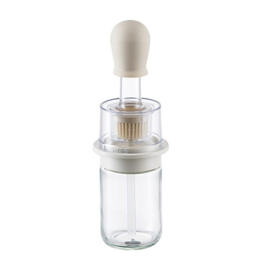 Bouteille et brosse pour une application culinaire polyvalente