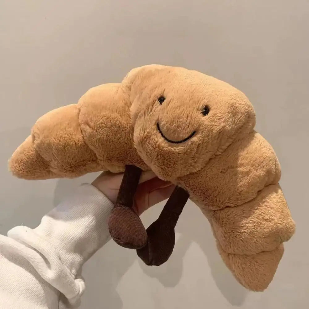 Coussin croissant en peluche montrant sa texture douce