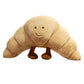 Vue latérale du croissant en peluche avec sourire