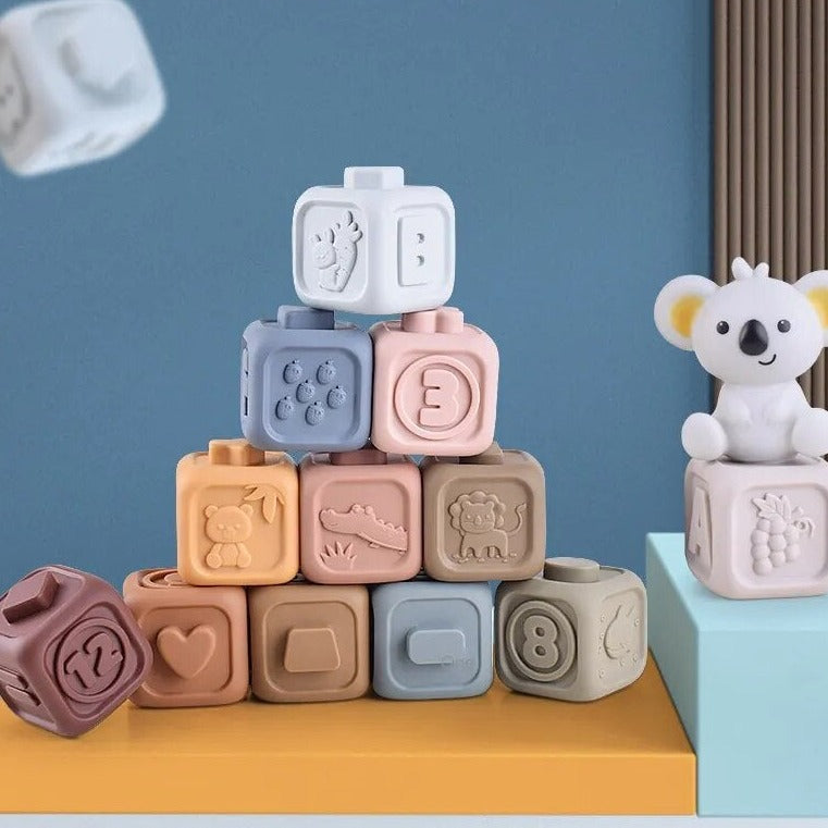 Blocs en silicone colorés pour bébés, empilés sur une table