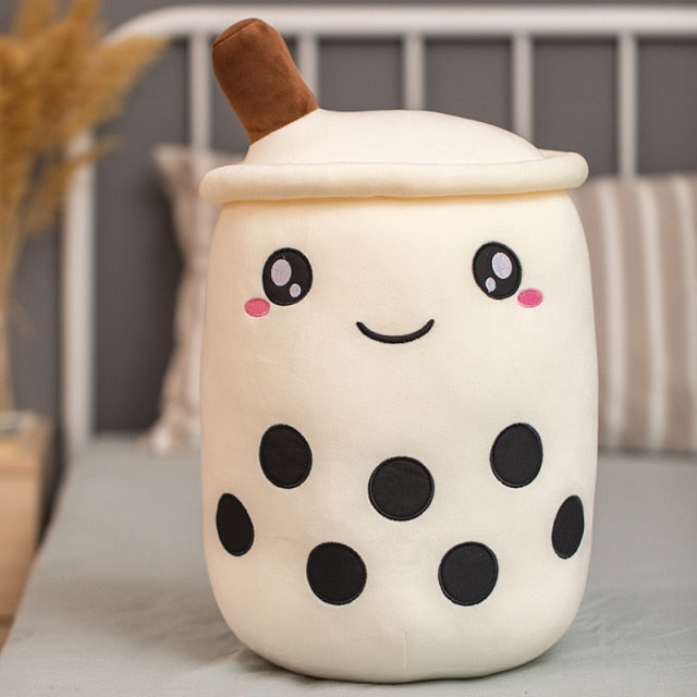 Coussin Bubble Tea posé sur un canapé, ambiance cosy