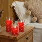 Bougie LED avec flamme vacillante sur fond sombre
