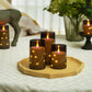 Trois bougies LED de tailles différentes sur une table