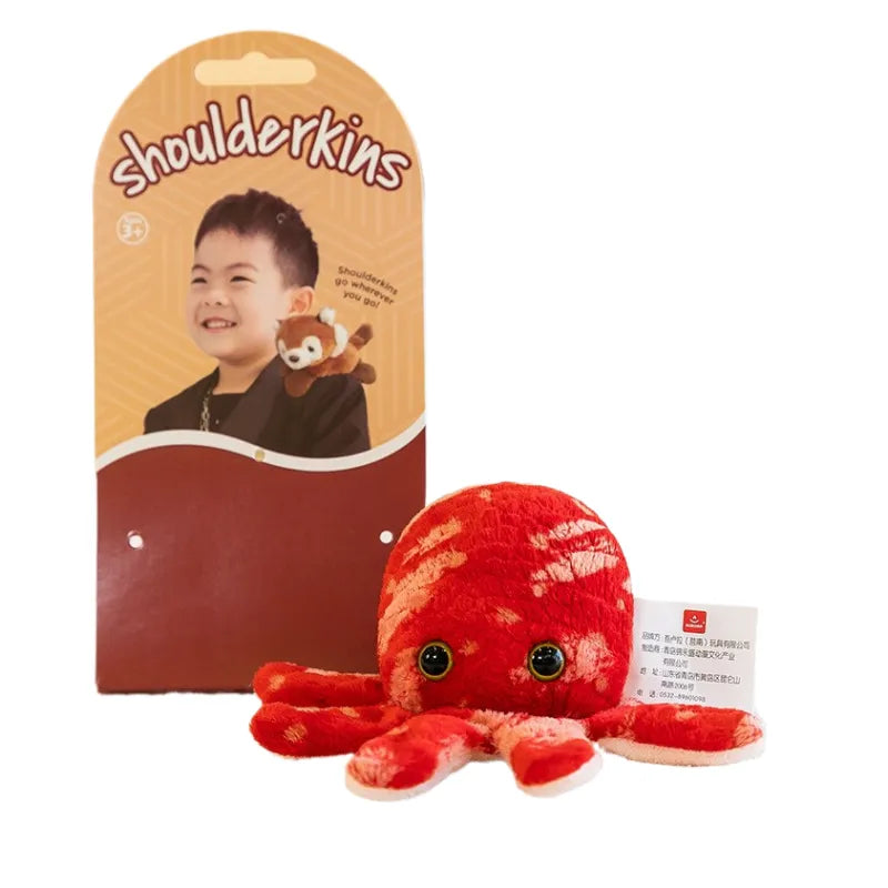Caméléon en peluche montrant son système d'attache magnétique