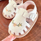 Sandales bébé fille avec broderie florale sur cuir synthétique