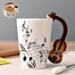 Tasse en céramique avec motifs d'instruments de musique