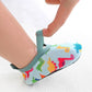 Chaussures aquatiques sur fond de sable, protection contre la chaleur