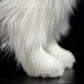 Peluche Border Collie allongée, expression amicale et fidèle