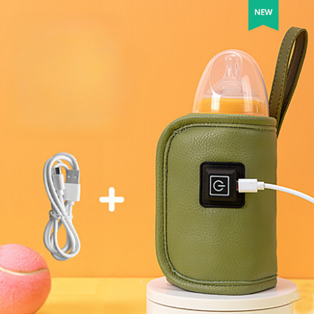 Chauffe-biberon sur une table avec des accessoires de bébé