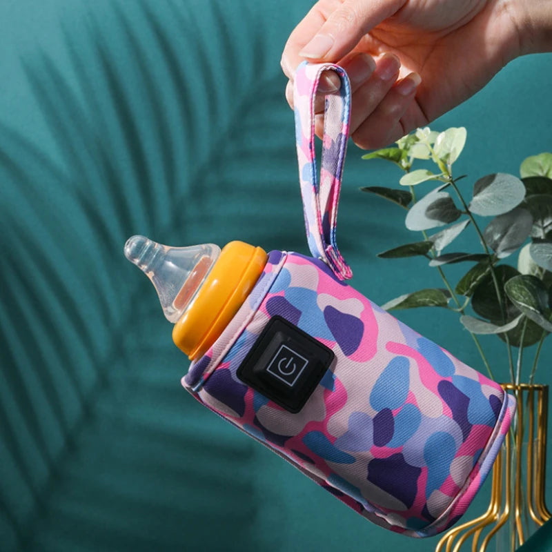 Chauffe-biberon avec câble USB connecté à un ordinateur portable