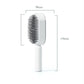 Brosse à cheveux avec fonction de nettoyage par pression