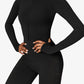 Combinaison shapewear noire vue de face sur mannequin