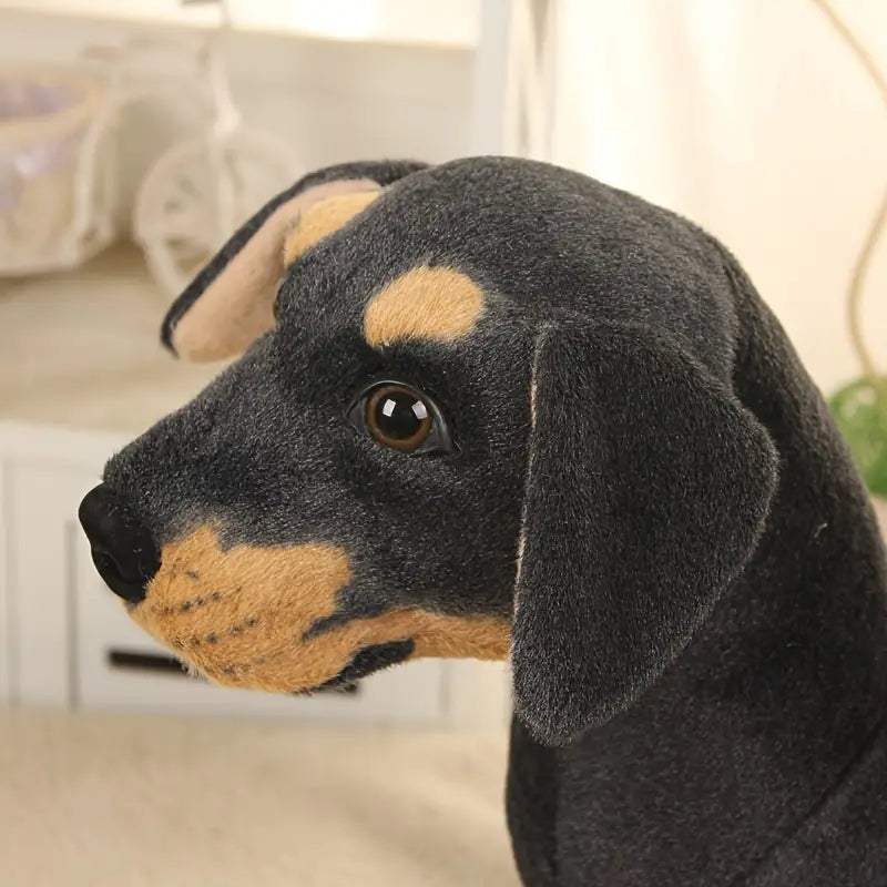 Vue latérale du jouet peluche chien noir