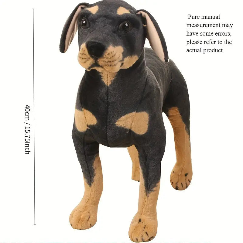 Chien en peluche noir posé sur un canapé