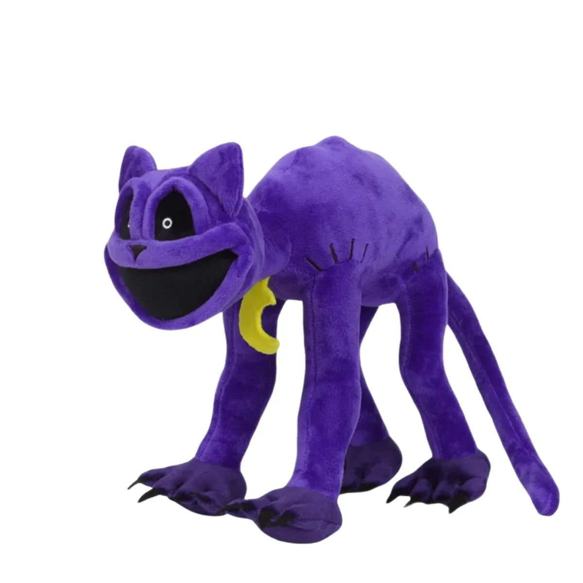 Jouet en peluche chat posé sur une surface blanche