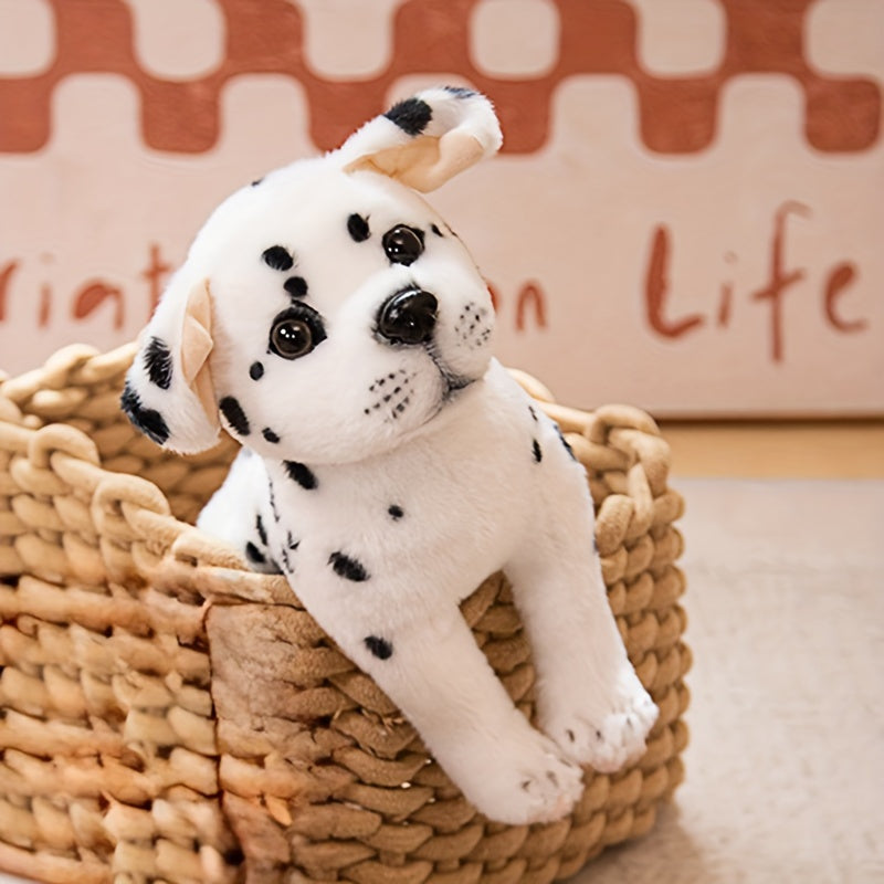 Chiot en peluche posé sur une couverture