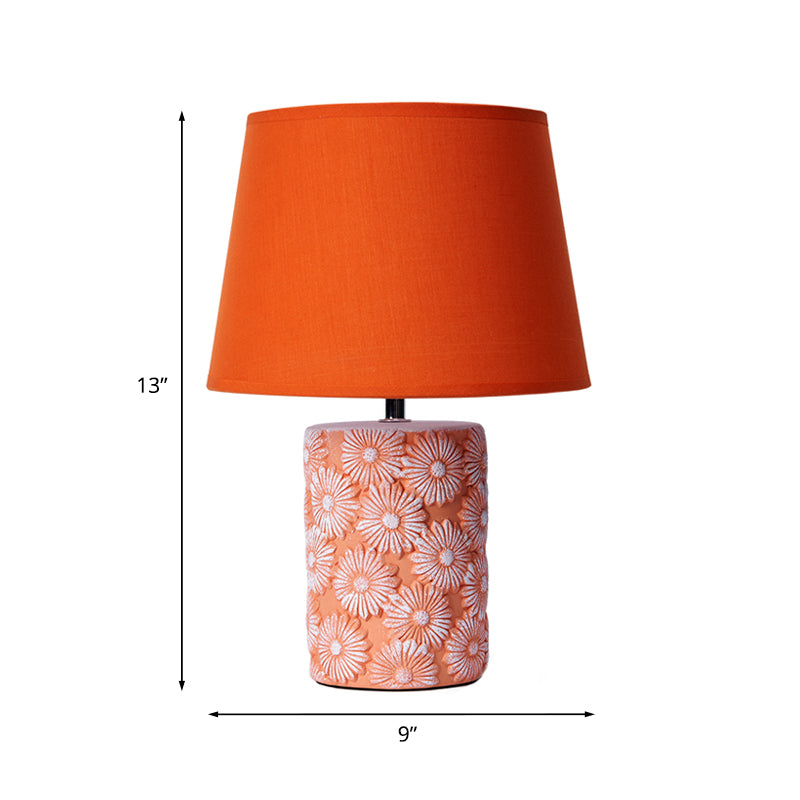 Lampe de table orange avec base tournesol sculptée