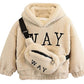Pull d'hiver enfant en tissu teddy doux sur cintre
