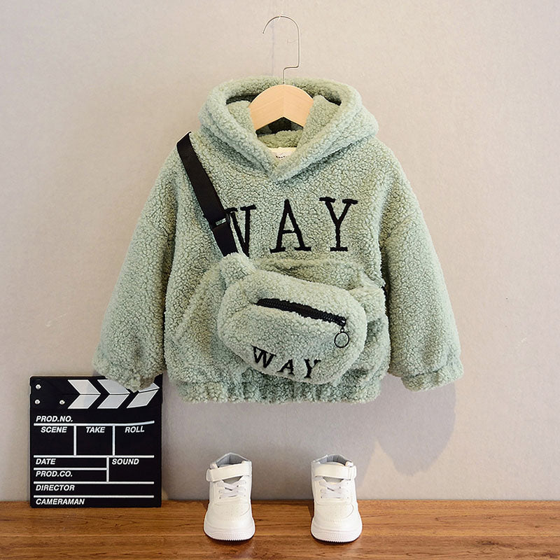 Gros plan sur la texture du pull teddy beige