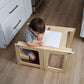 Tour d'apprentissage utilisée comme table, enfant jouant dessus