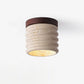 Lampe de plafond en travertin vue de côté