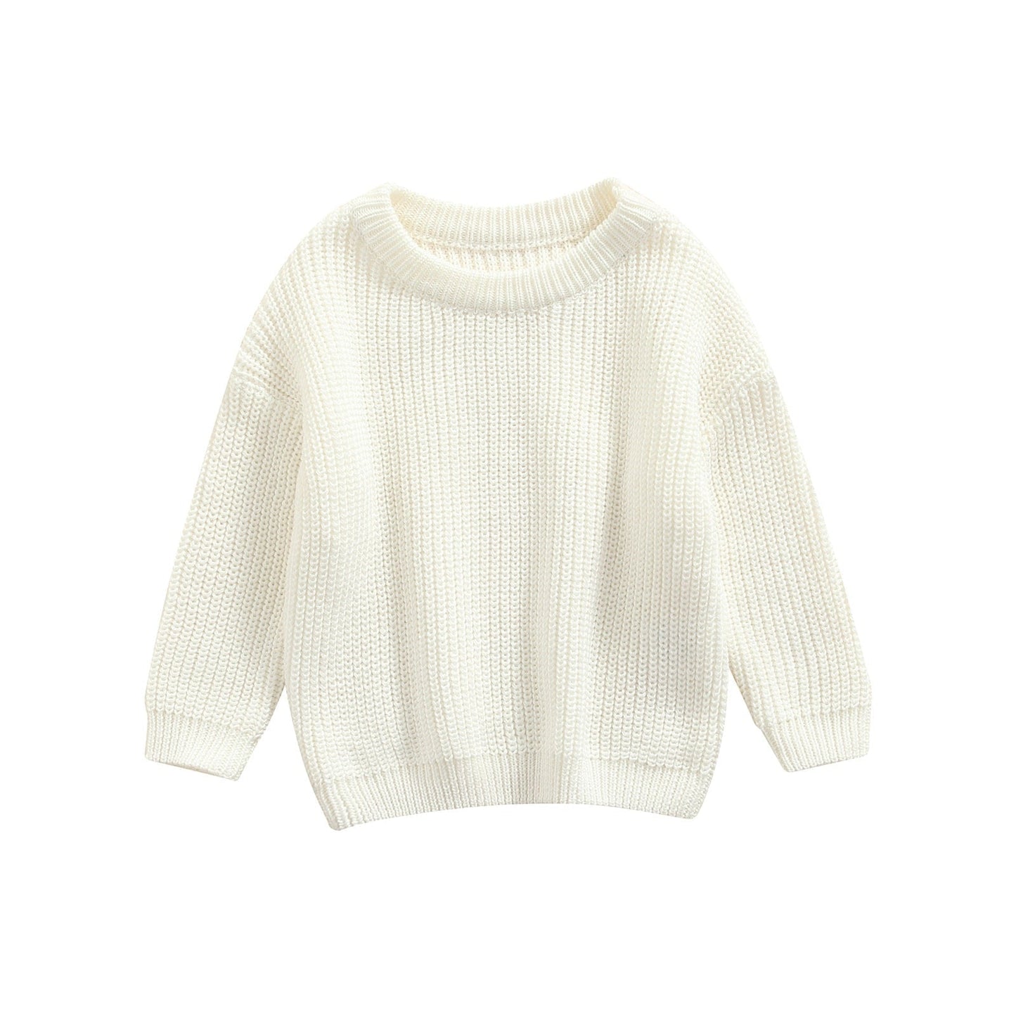 Gros plan sur la maille d'un pull enfant, couleur unie
