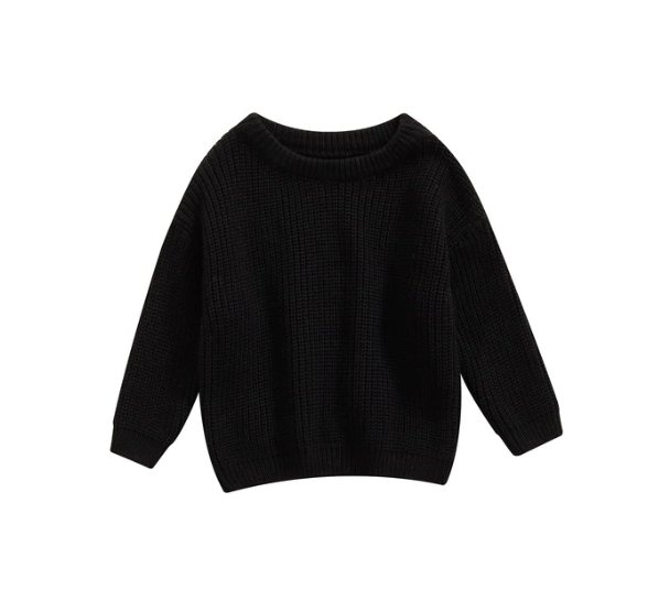Zoom sur le col d'un pull bébé, finition soignée