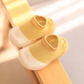 Chaussures bébé jaunes avec semelle en caoutchouc souple