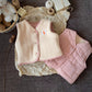 Gilet enfant réversible, côté rose exposé