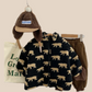 Vue de face du gilet en fleece vert motif ours