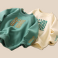 Pull enfant unisexe vert avec grand smiley sur le devant