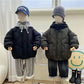 Détail de la capuche ludique sur veste enfant