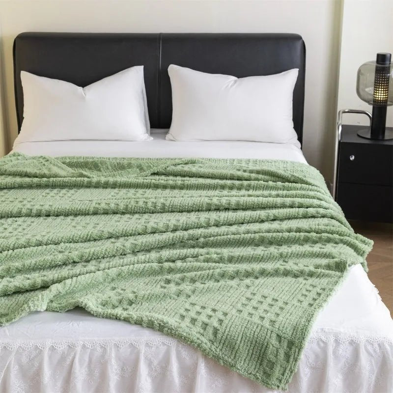 Détail du motif gaufre sur une couverture en velours