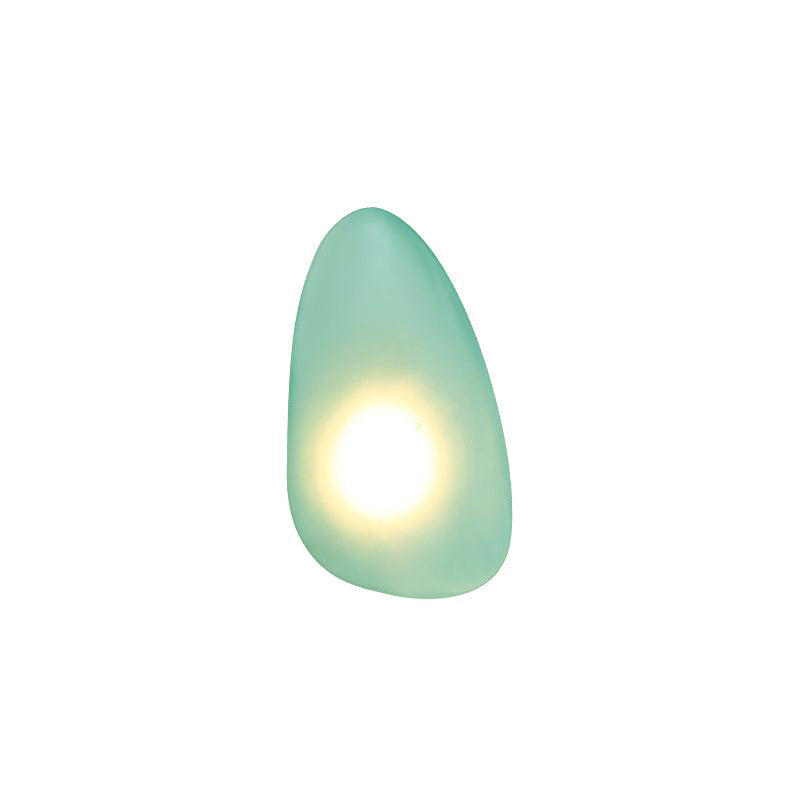 Détail du montage mural de l'applique en métal et verre