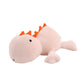 Vue latérale du dinosaure en peluche lesté