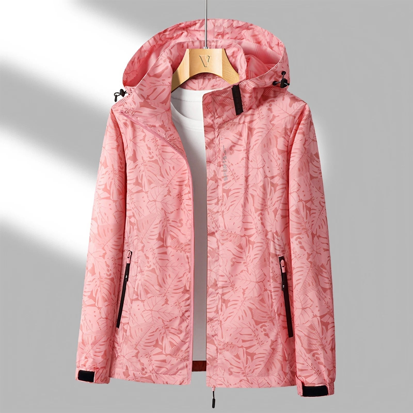 Veste imperméable femme avec capuche ajustable et poches zippées