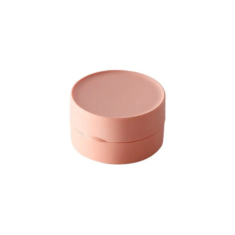 Petite boîte à savon rose avec un design épuré