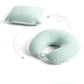 Coussin de voyage vert plié en forme d'oreiller
