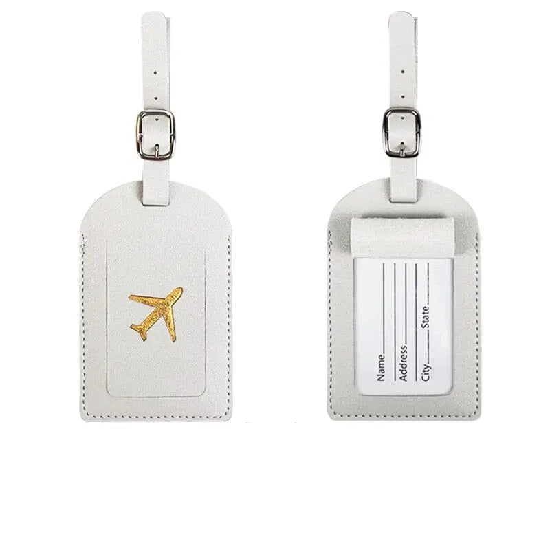 Étiquette blanche avec avion doré, contraste élégant