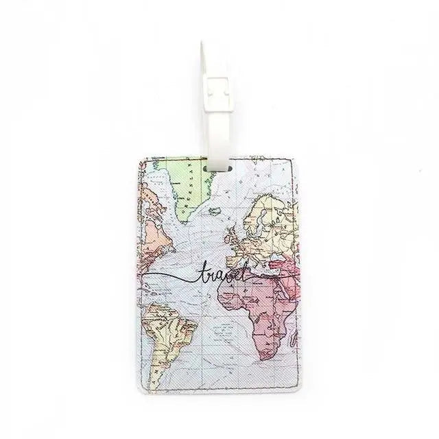 Étiquette bagage avec carte du monde colorée et inscription 'travel'