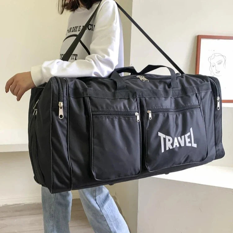 Sac de voyage noir, poches extérieures et poignée robuste