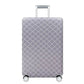 Vue de côté d'une housse de valise avec motifs géométriques