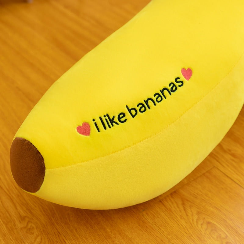 Gros plan sur une peluche banane riant avec grands yeux