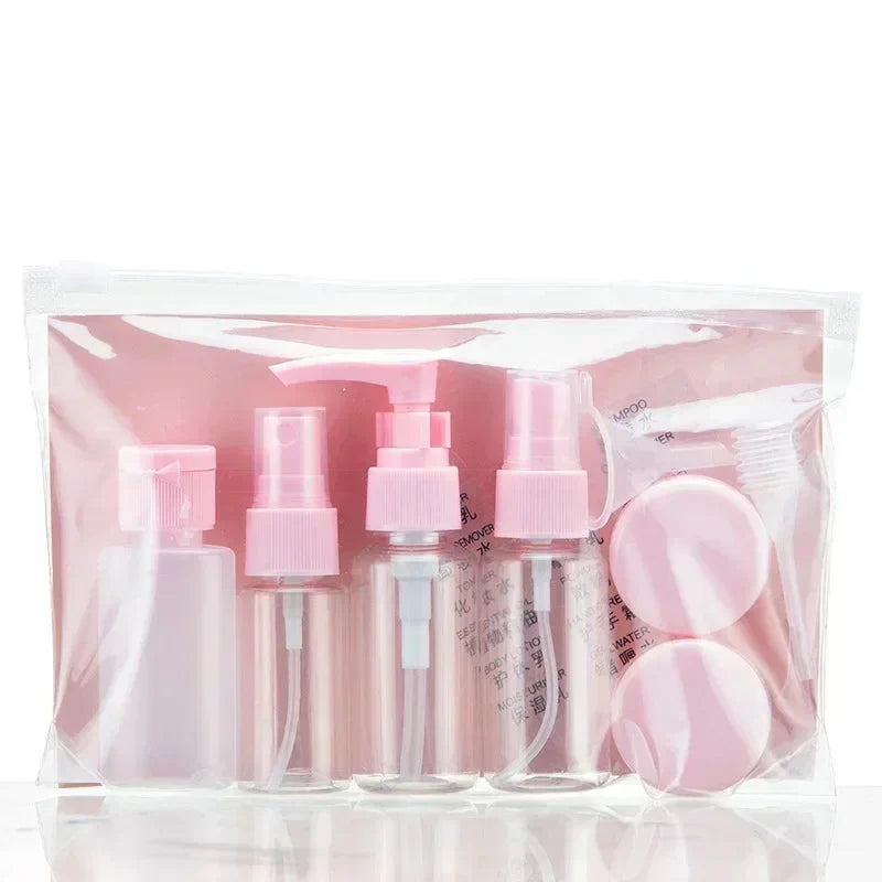 Kit de voyage avec flacons roses et accessoires