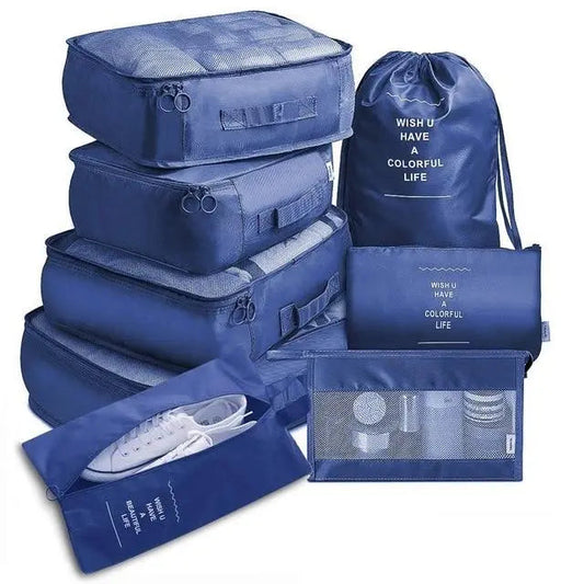 Ensemble de huit organisateurs de valise bleu marine sur fond blanc