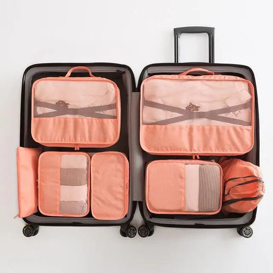 Set de 7 pochettes de rangement rose saumon pour valise